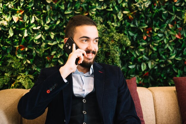 Cheerful man talking on phone