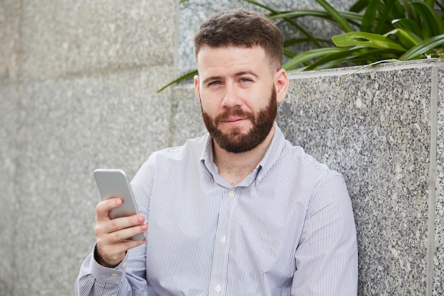 Cheerful man with smartphone