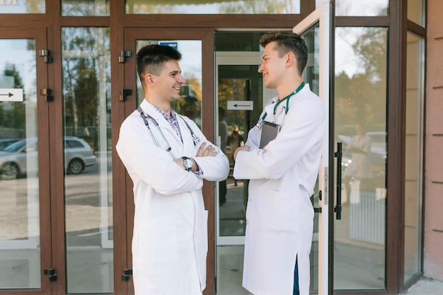 Cheerful medic colleagues at hospital