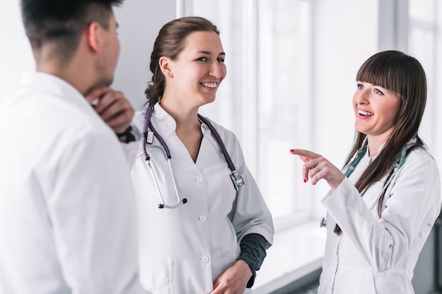 Cheerful medic colleagues in hospital