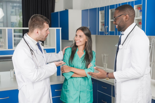 Cheerful medics standing in hospital