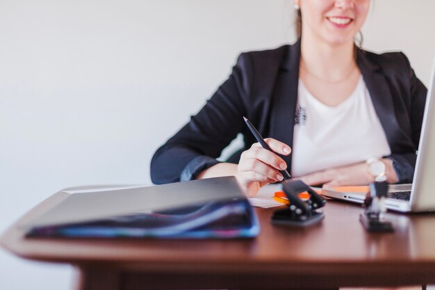 Cheerful office working woman at workplace