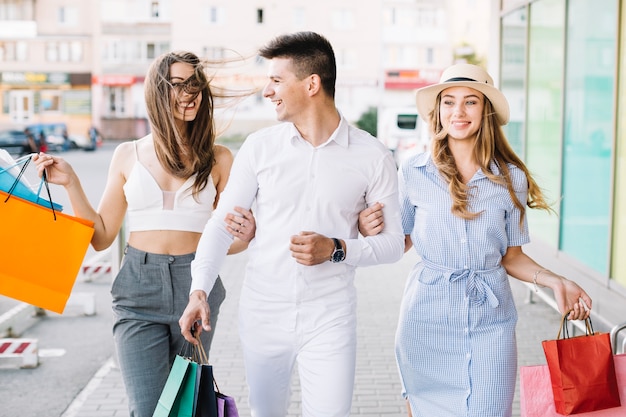 Cheerful people enjoying shopping together