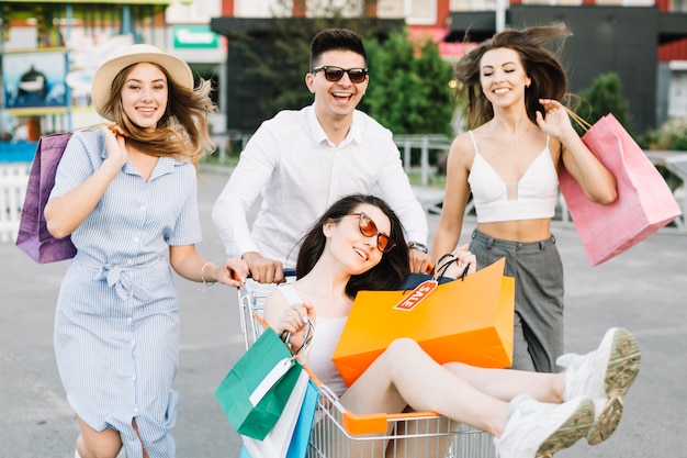 Cheerful people having fun in shopping mall