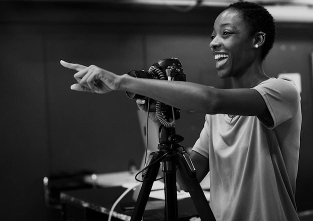 Cheerful photographer giving instructions in the studio