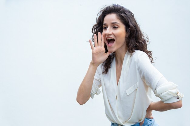 Cheerful positive woman girl shouting loud