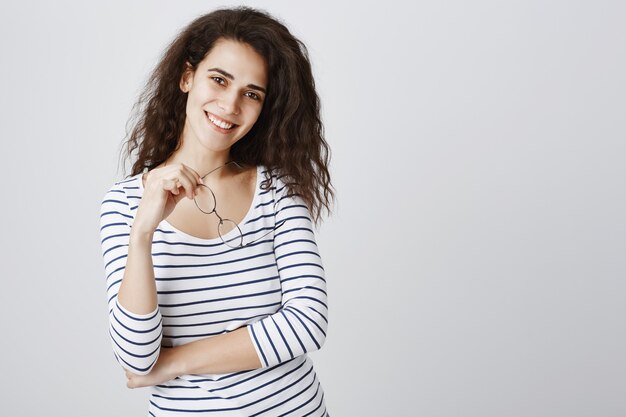 Cheerful pretty brunette smiling with happy expression