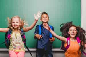 Free photo cheerful pupils having fun