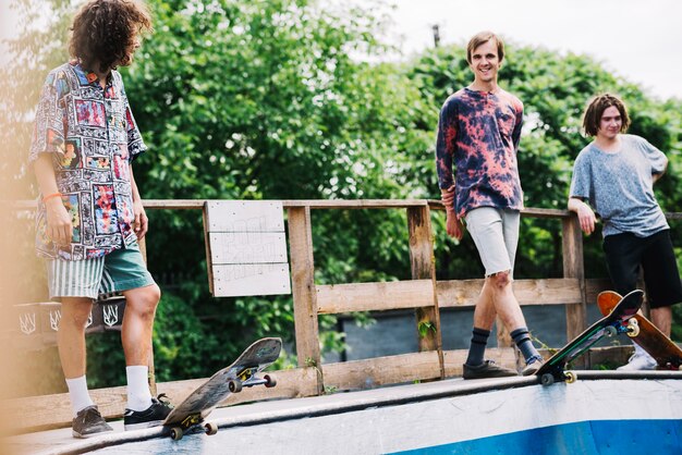 Cheerful skateboarders in park