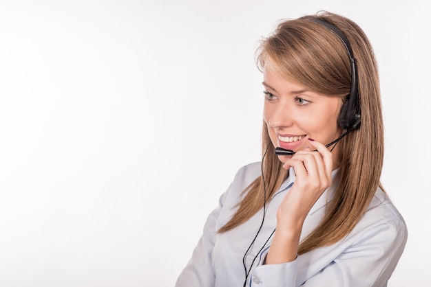 Cheerful smiling support phone female operator in headset at off