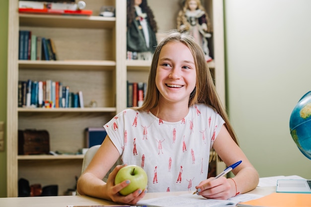 Cheerful student with apple