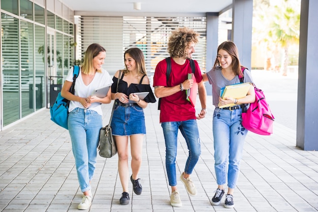 Cheerful students communicating after lessons