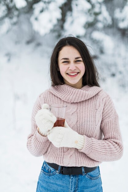 Cheerful teenager with tea