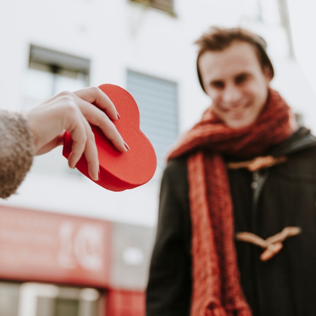 Free photo cheerful unrecognizable man receiving gift