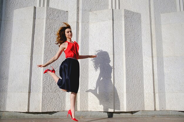 Cheerful woman jumping happy