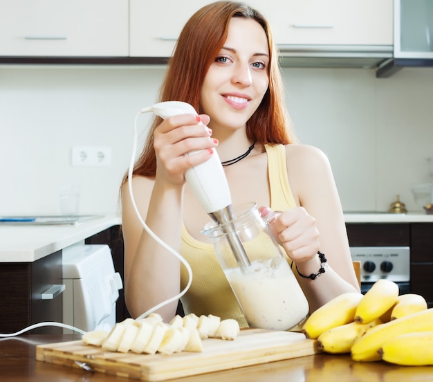 cheerful woman  making milk shake