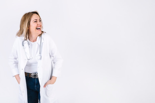 Free photo cheerful woman in medical overall laughing