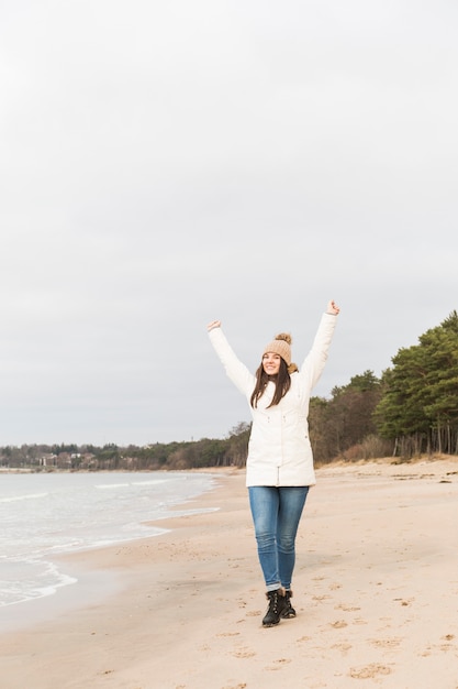 Cheerful woman near sea