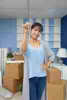 Free photo cheerful woman in new flat