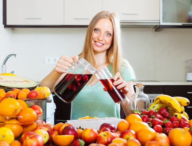 cheerful woman pouring beverages