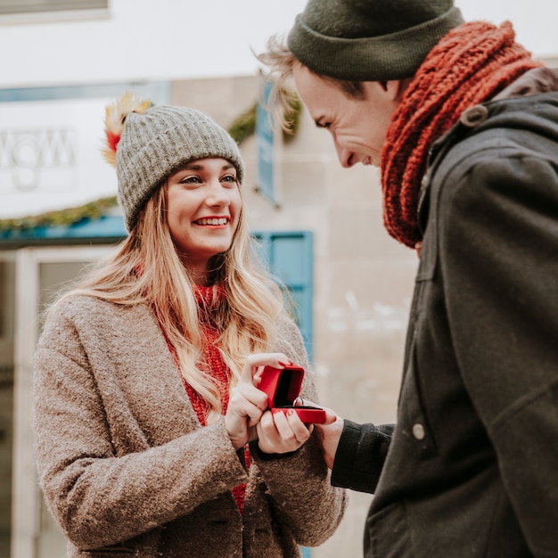 Free photo cheerful woman proposing to boyfriend