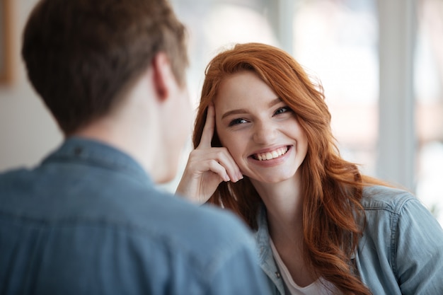 Cheerful woman sitting in cafe