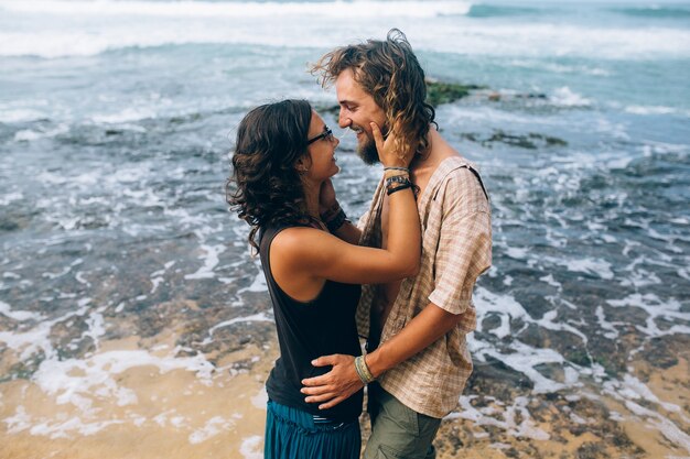 Cheerful woman touching her boyfriend's face