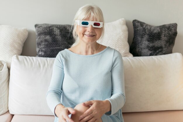 Free photo cheerful woman watching film