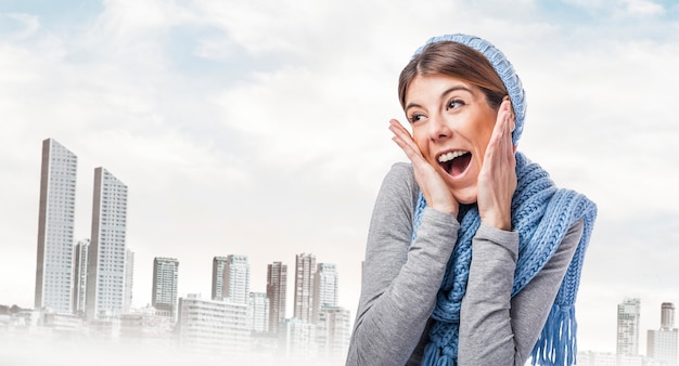 Cheerful woman with city in the distance