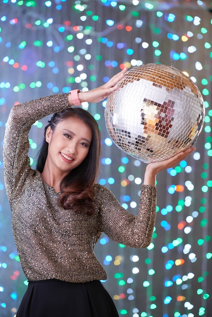 Free photo cheerful woman with discoball