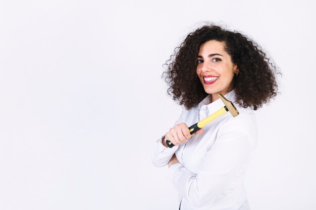 Cheerful woman with hammer