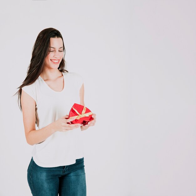 Free photo cheerful woman with heart box