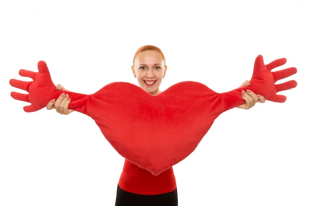 Cheerful woman with plush heart