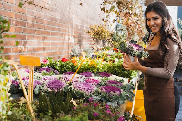 Free photo cheerful woman with purple cabbage