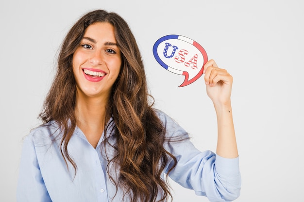 Cheerful woman with USA speech balloon