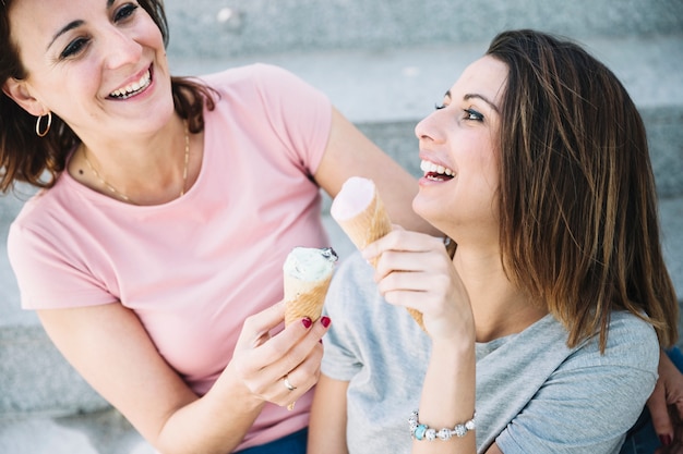 Cheerful women eating ice-cream