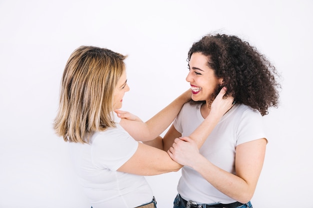 Cheerful women looking at each other