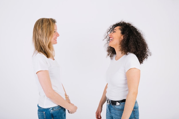 Free photo cheerful women looking at each other