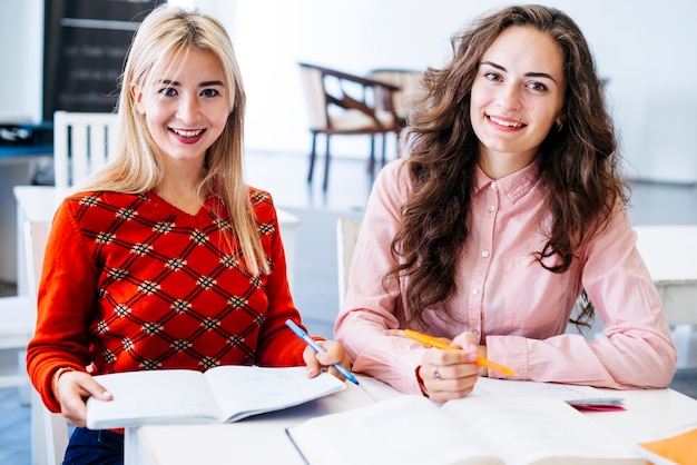 Cheerful women preparing to exam