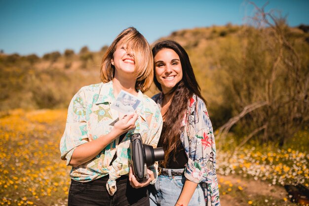 Cheerful women showing picture