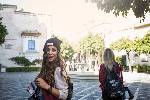 Cheerful women on square