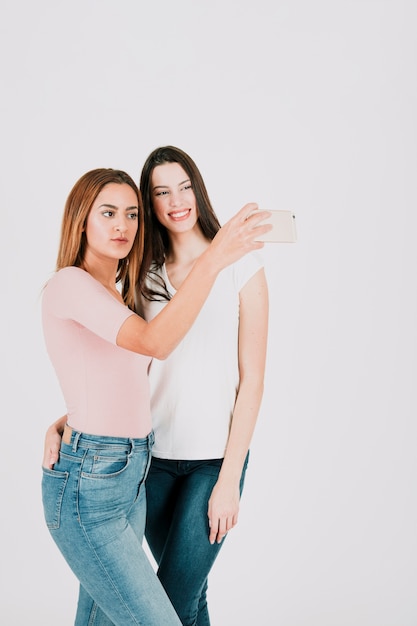 Cheerful women taking selfie