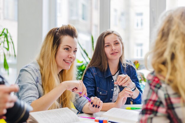 Cheerful women working in group