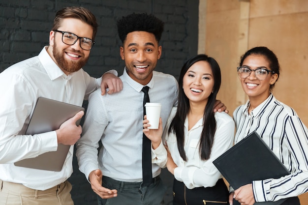 Free photo cheerful young business colleagues