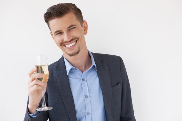 Cheerful Young Entrepreneur Raising Glass of Wine