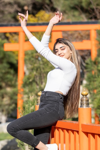 Cheerful young girl stand on and looking at the camera High quality photo