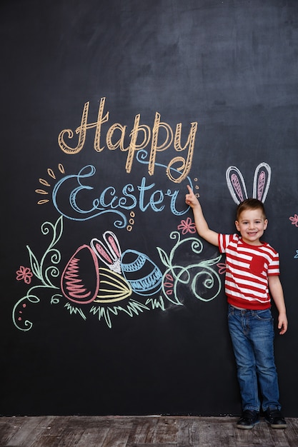 Cheerful young kid wearing bunny ears