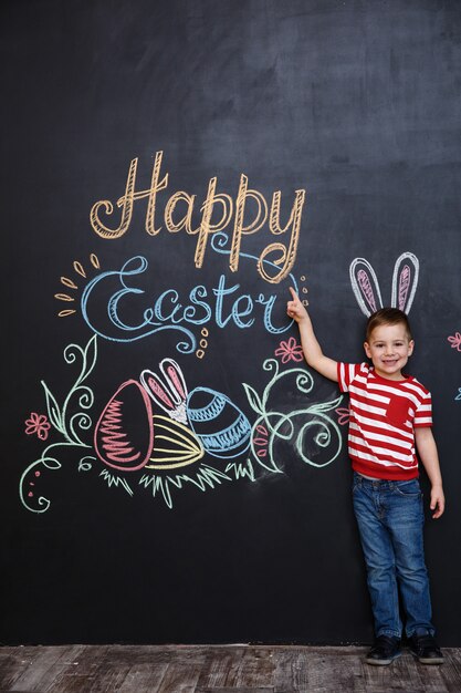 Cheerful young kid wearing bunny ears