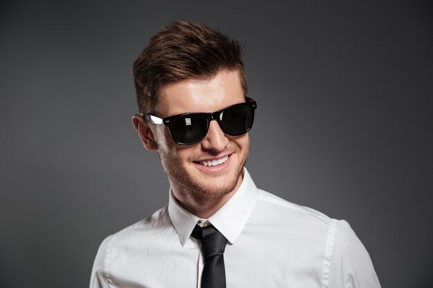 Cheerful young man dressed in formalwear