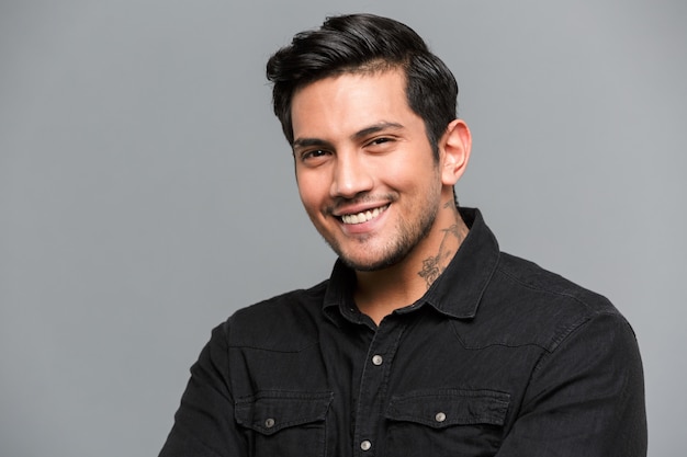 Free photo cheerful young man standing isolated